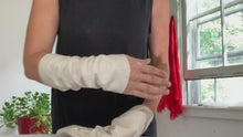 Load and play video in Gallery viewer, hands showing how to wear lamiadesign fashion arm sleeves