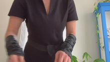 Load and play video in Gallery viewer, Product video: woman showing how to wear  Lamia Design black  leather sleeves