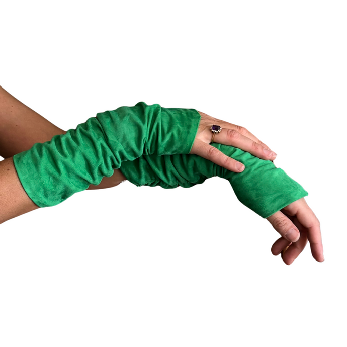 Green suede fashion arm  sleeves  being worn on a white background