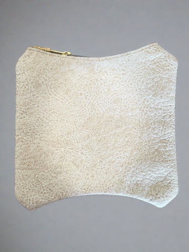 beige vegan leather bag with a golden zipper