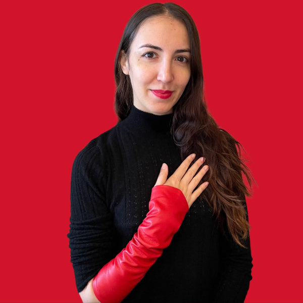 Wonderful Woman wearing red sleeves with a black neck pullover and a red background of the woman