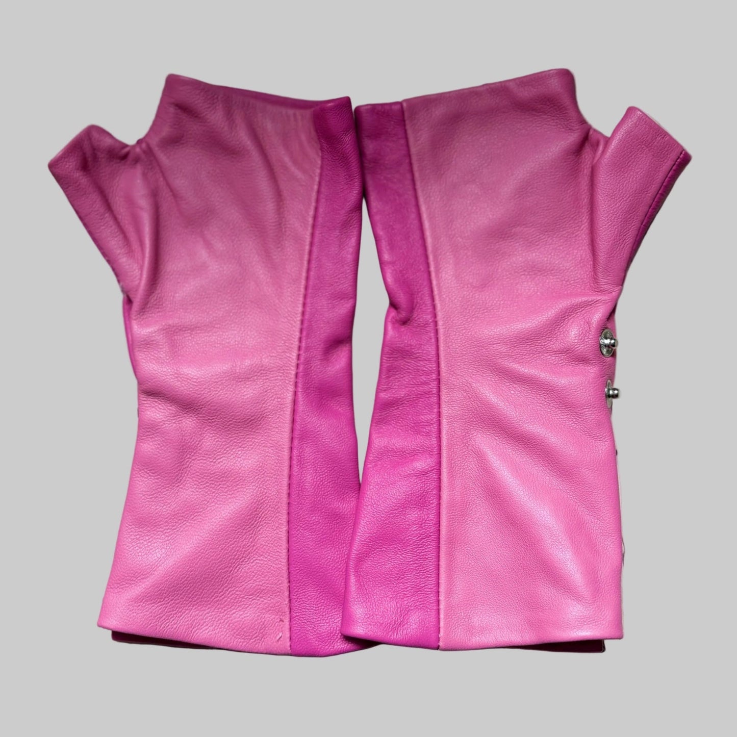 the back of the glove is showing which is rose color fingerless leather gloves