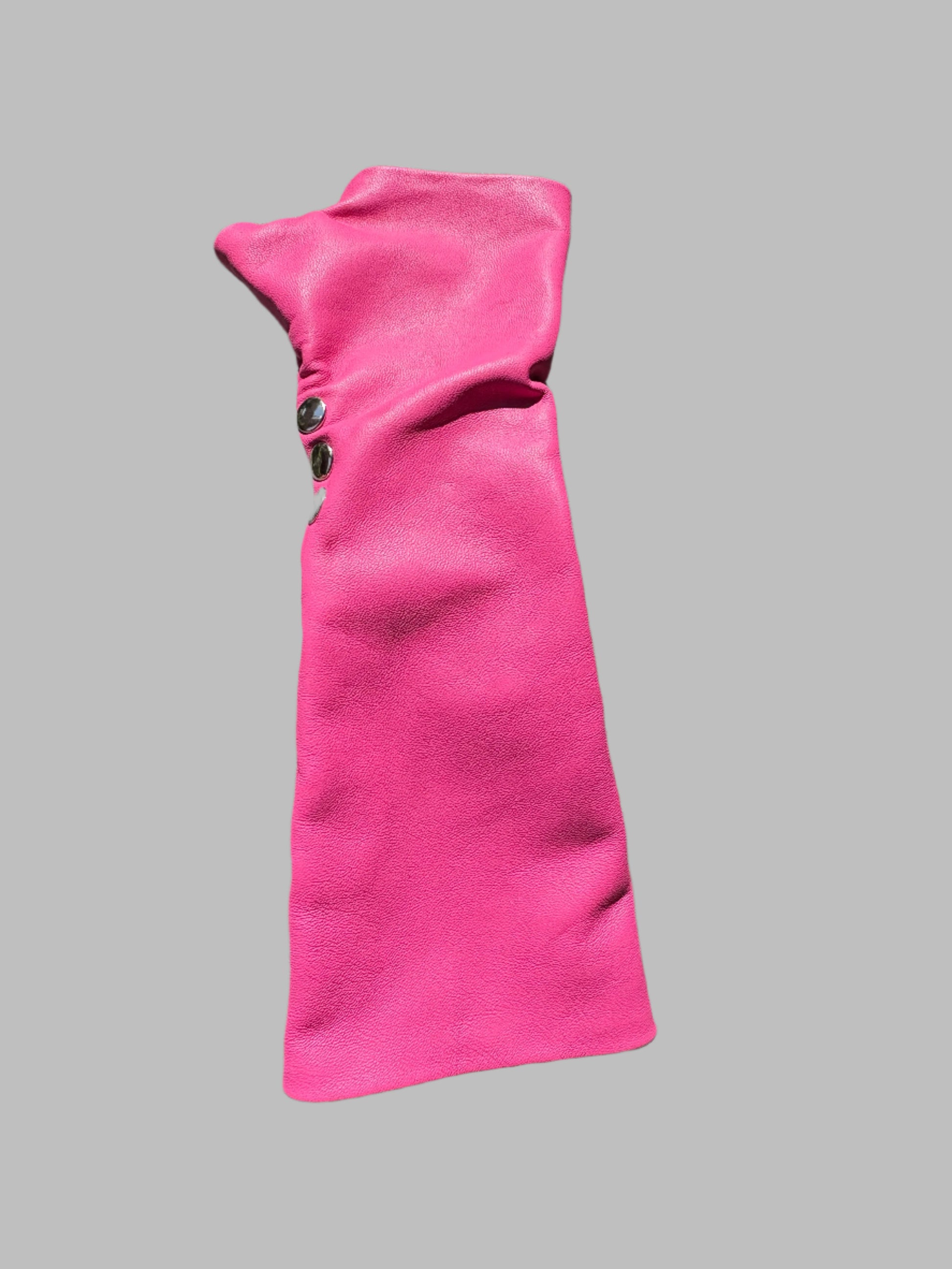 One fingerless pink leather glove with three silver snaps