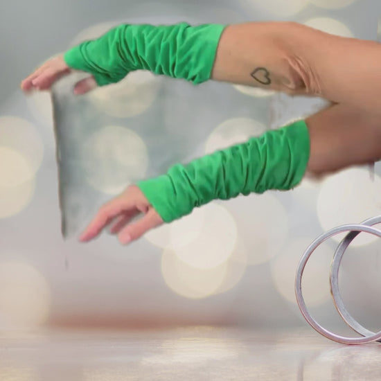 Close-up Video of soft green suede arm sleeves, stylish and comfortable
