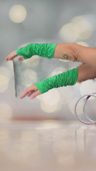 Close-up Video of soft green suede arm sleeves, stylish and comfortable