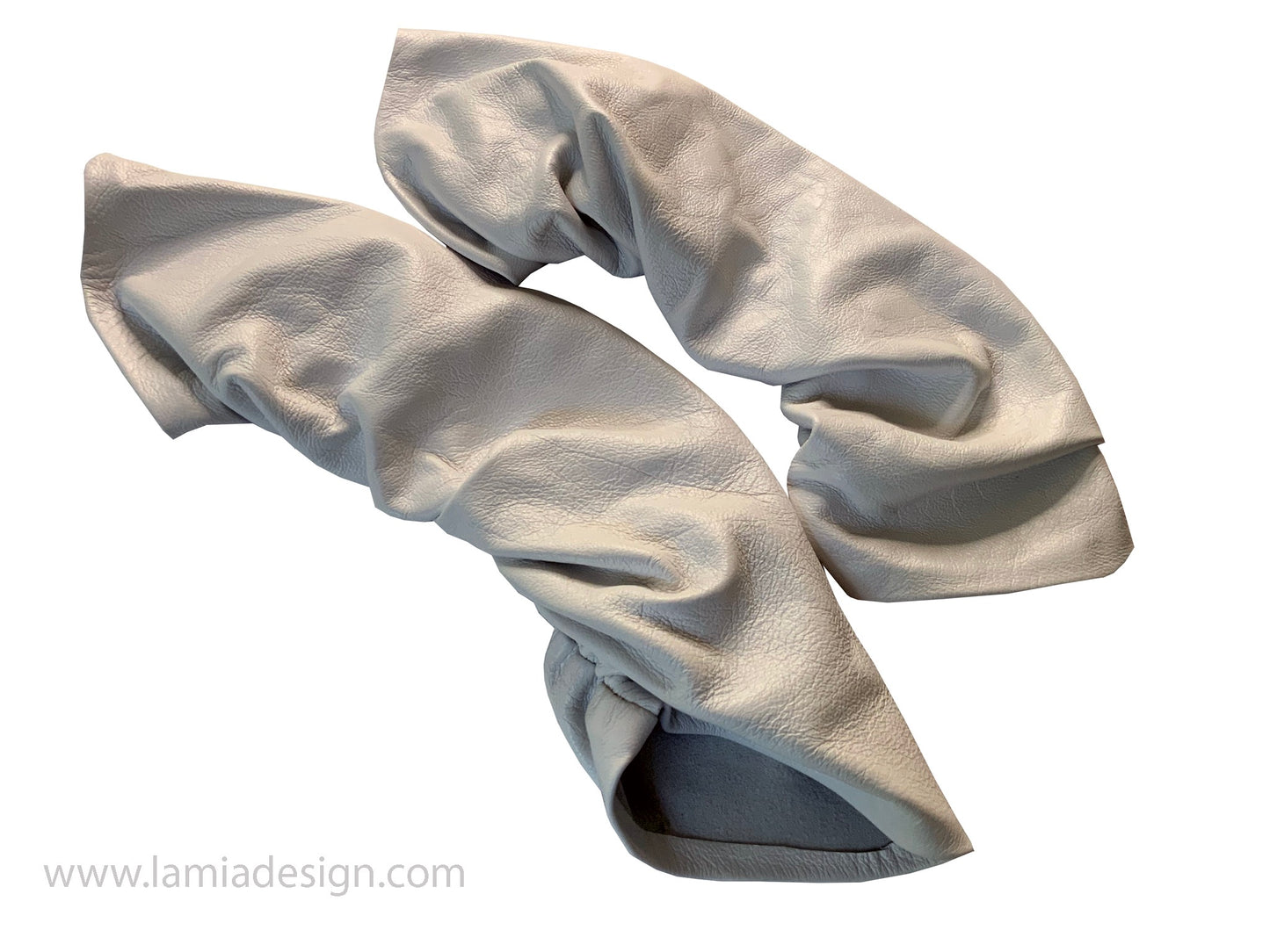 A pair of off white  leather elbow sleeves with a textured pebbled finish, shown on a plain white background with a watermark at the bottom left.