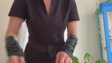 Load and play video in Gallery viewer, Product video: woman showing how to wear  Lamia Design black  leather sleeves  
